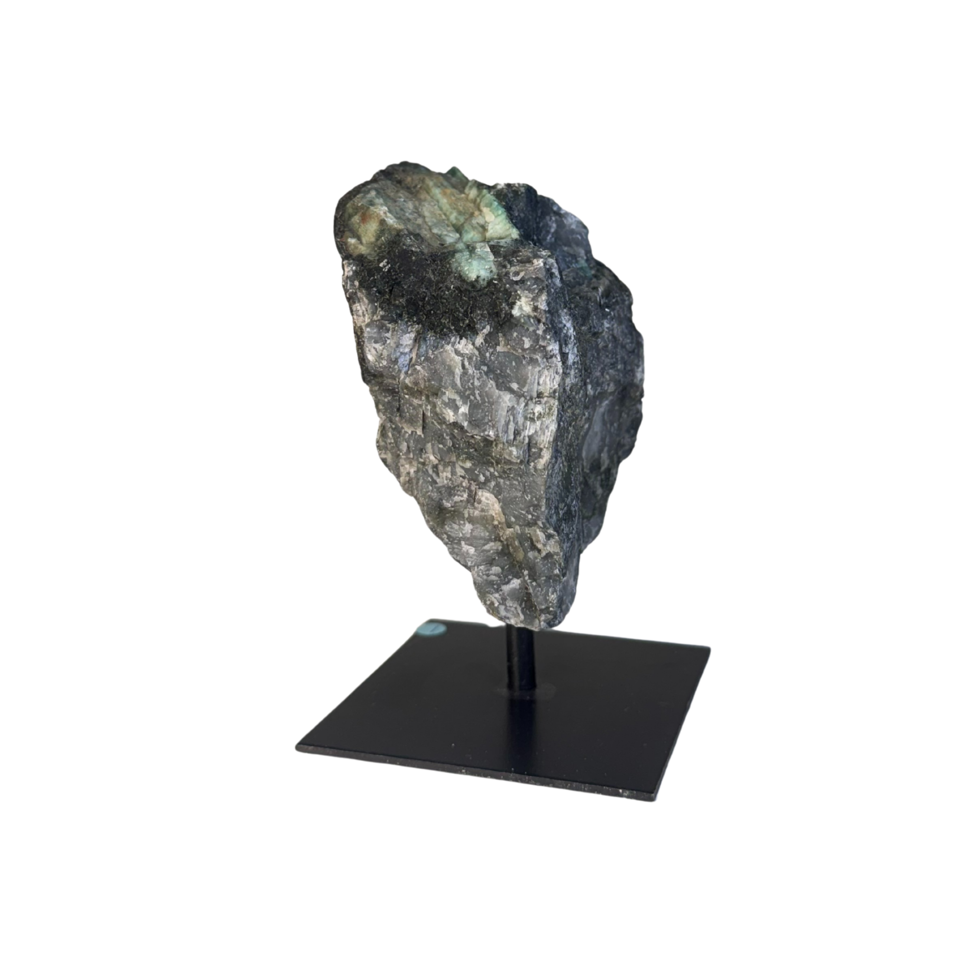 Emerald rough on metal stand #1